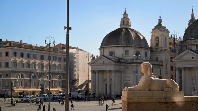 A wide perspective of the historic Piazza del Popolo in Rome featuring the central Egyptian obelisk the twin Baroque churches and the neoclassical fountains under a clear sky