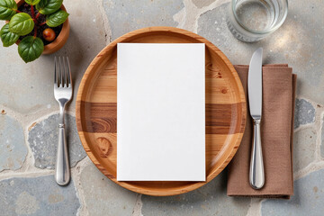 Blank menu mockup on wooden plate with cutlery and brown napkin on stone background.