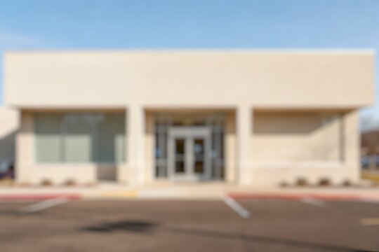 Blurred background front view of a retro bank building