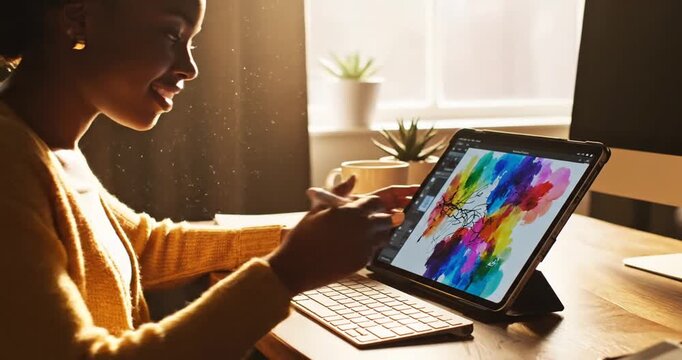 Young woman using a tablet to create vibrant digital art at a cozy workspace with plants
