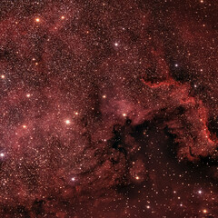 Crimson Hues of a Stellar Nursery © Mubashar