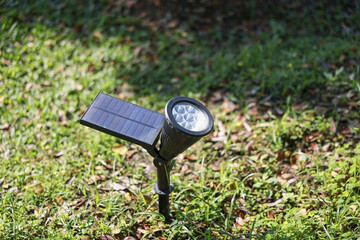 Black solar light with power panel providing sustainable green energy. An outdoor led garden lamp for yard illumination, showcasing modern eco friendly technology