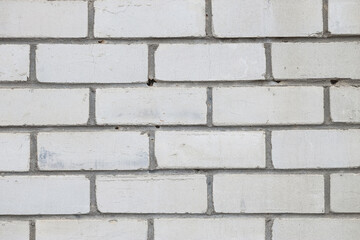 Fototapeta premium Texture of white brick wall as background, closeup