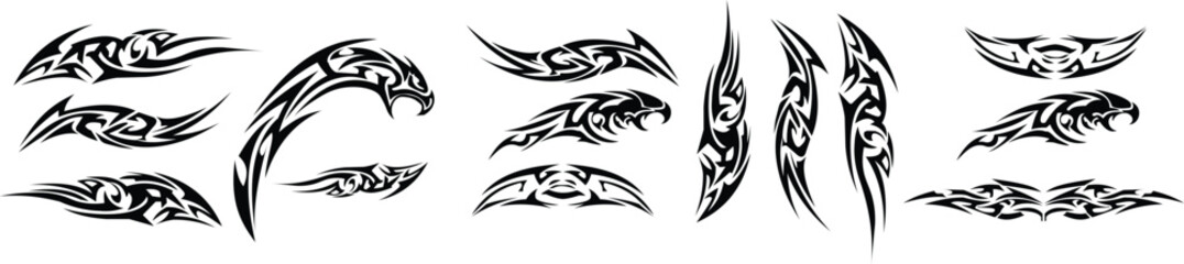 Collection of black tribal tattoo designs and decals featuring abstract feline and claw motifs © Yasmin