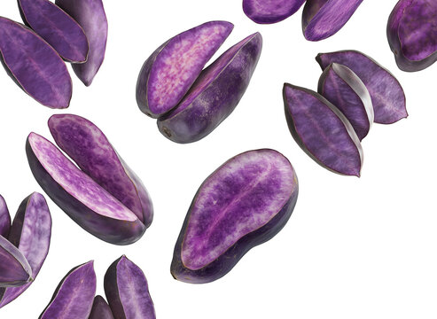 Whole and sliced purple yams or sweet potato, isolated on a white background, concept of exotic root vegetable texture