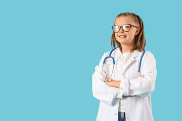 Cute doctor smiling on blue background