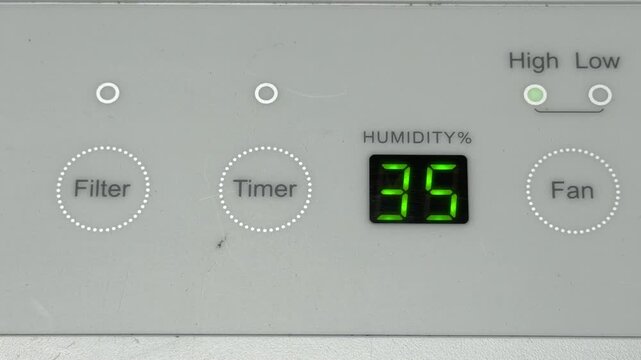 The perforated radiator panel pulls in air to regulate humidity levels. This continuous suction creates a steady, rhythmic mechanical hum that resonates through the appliance.