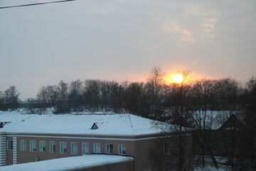 sunset on a city building, winter, cold, frost, sky,