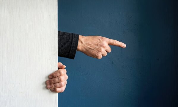 Hand Gesturing Direction: An authoritative hand emerges, pointing confidently towards an unseen direction, set against a dark blue background. The gesture conveys focus, decision.