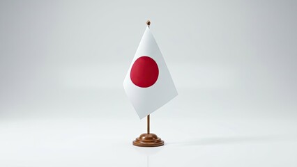 Fototapeta premium Japan Flag Displayed: A crisp Japanese flag, with its iconic red sun emblem, stands proudly on a small wooden stand. Perfectly demonstrating symbolism, culture, and national identity.