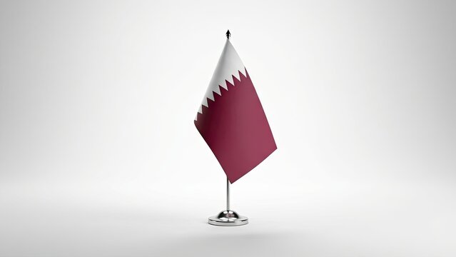 Qatar Flag Emblem: A pristine, elegantly displayed Qatari flag stands tall, its maroon and white hues a symbol of national identity and pride.