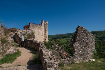 Medieval Castle of Penne perched on a rock with the houses of the village 