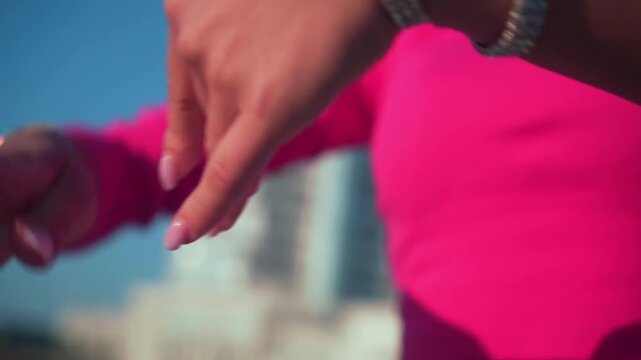 Close-up of a woman's hand in jewelry. Asian woman with sexy body dances belly dance.