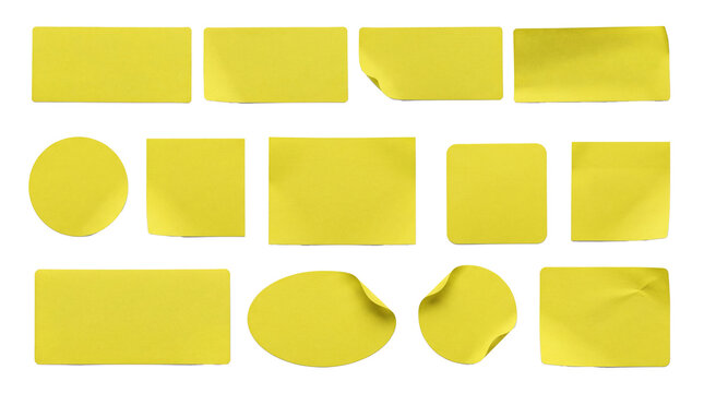 collection of assorted yellow sticky notes in various shapes and sizes, scattered on a dark background for creative notes.