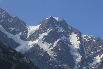 Mountain landscape of the North Caucasus mountains near Mount Elbrus on a sunny summer day