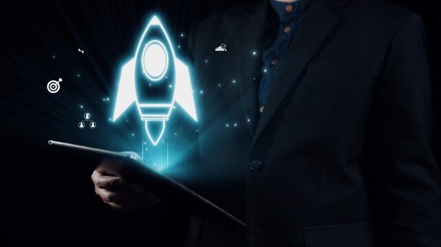 A businessman in a suit holds a tablet as a glowing rocket icon ascends amidst digital graphics symbolizing innovation, growth, and modern technology concepts. Qubit