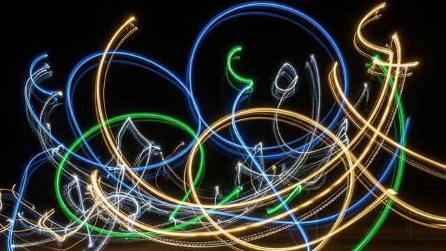 Dynamic and vibrant abstract luminous light trails, created with long exposure photography and light painting effects, gracefully interweave and loop across a deep black background, perfect for modern