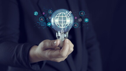 Business professional holding light bulb with global digital technology interface overlay, representing innovation, artificial intelligence, data analytics, smart solutions transformation concept.