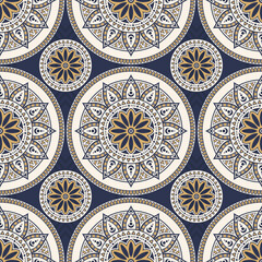 Obraz premium Elegant seamless mandala vector pattern with intricate geometric floral ornaments in navy blue, gold and cream. Luxury ethnic ornamental color background. For textiles, packaging, tiles and decor.