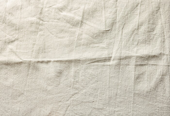 Wrinkled cotton fabric texture in beige color