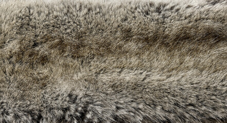 Faux fur texture background in brown and beige tones