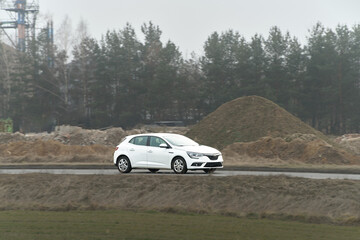 Fuel-efficient compact car in nature setting