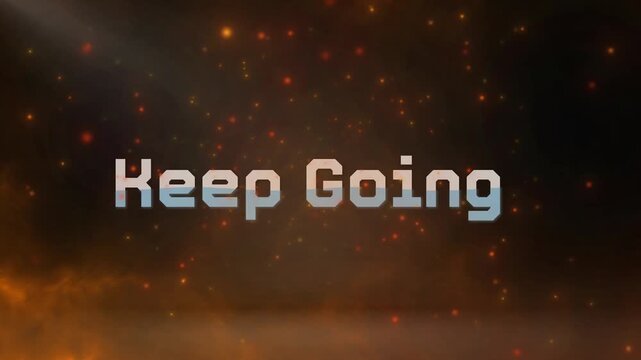 A motivational video with a keep going message in a dark background with orange lights