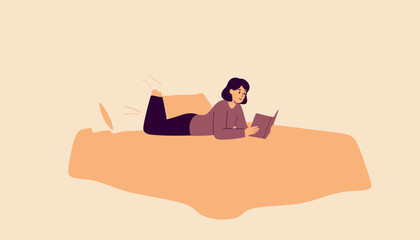 Obraz premium A relaxed young woman is comfortably lying on her stomach in a soft, cozy bed, completely immersed in reading an intriguing book, enjoying a peaceful moment of solitude and intellectual engagement wit