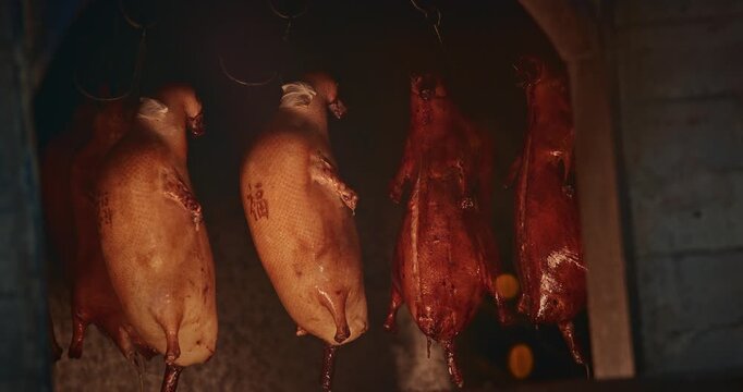 Hanging roast Peking Duck s in Smokehouse Capturing Culinary Art