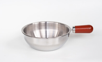 Stainless steel saucepan with wooden handle isolated on white background. Empty metal cooking pot for kitchen and culinary use. 