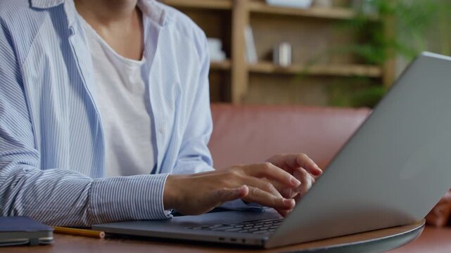 Close Up of Woman Typing on Laptop Keyboard