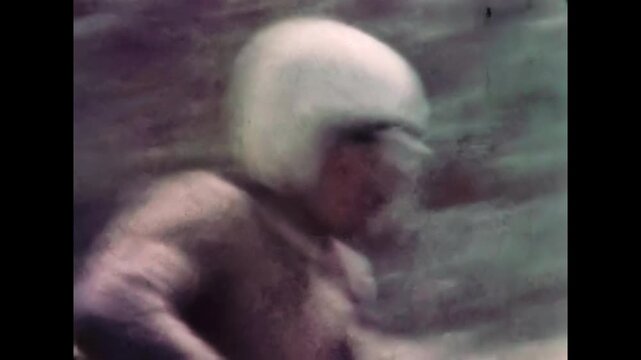 Close up view, motorcycle sidecar motocross team racing at high speed along dusty road in competition. Adrenaline in teamwork of off-road motorsport. Archival racing. Old film. Retro vintage archive
