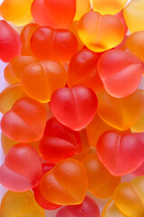 Heart-shaped jellies in vivid colors. Close-up detail cuts of the sweet jellies.