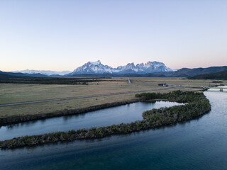 Torres del Paine, Chile: Dramatic view of the Serrano river by Torres del Paine National park of Patagonia, Chile with Cordillera del Paine in the background at sunset