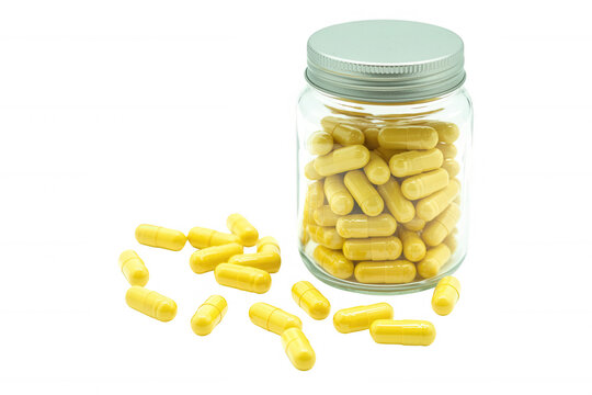 Yellow capsules in glass jar medicine isolated on a transparent background