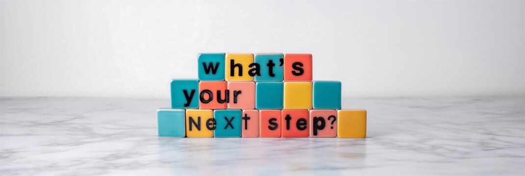Colorful building blocks spelling out the question whats your next step encouraging thoughtful consideration for future plans and decisions
