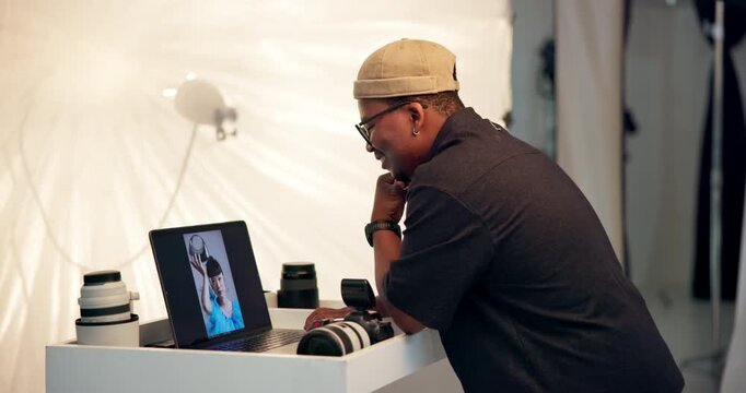 Laptop screen, photography and review with black man in studio for image selection of magazine shoot. Choice, display and picture with photographer bts on set for decision, fashion catalog or results
