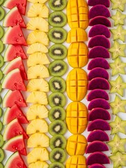 Vibrant fresh fruit array forming a colorful textured composition