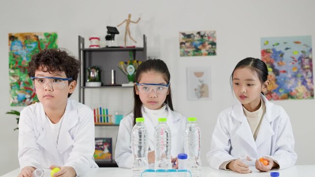 Asian Students Conduct Bernoulli Principle Science Experiment with Ping Pong Balls