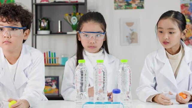 Asian Students Conduct Bernoulli Principle Science Experiment with Ping Pong Balls