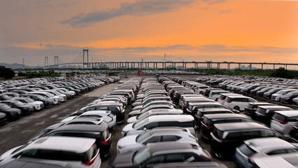 Big huge parking lot with many new cars, factory auto, dealerships salon outdoor, automotive sales industry. Transport terminal. Top aerial drone view. Long rows decommissioned vehicles, scrap metal. © SERGEI
