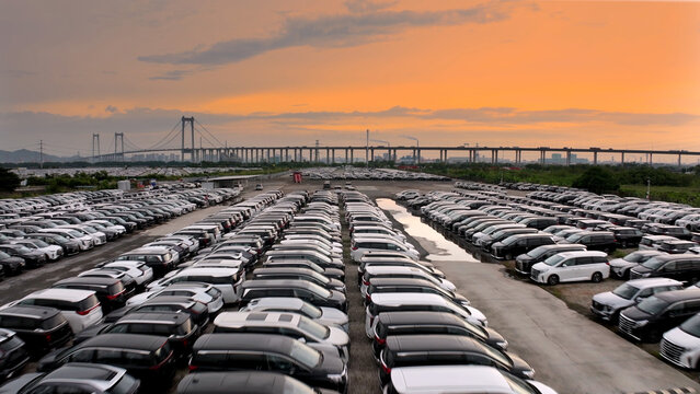 Big huge parking lot with many new cars, factory auto, dealerships salon outdoor, automotive sales industry. Transport terminal. Top aerial drone view. Long rows decommissioned vehicles, scrap metal.