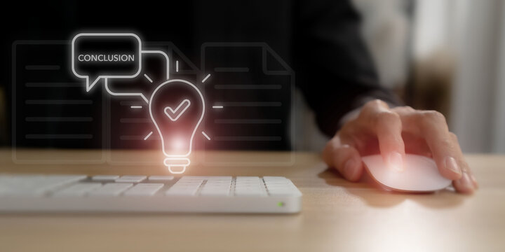 Strategic conclusion and final insight concept. A professional uses a mouse beside a keyboard as a glowing lightbulb and Conclusion icon, symbolizing analysis, insight and final business decisions.