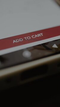 Finger taps the ADD TO CART button within the ecommerce app interface