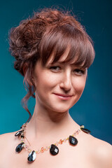 Portrait of Winsome Sexy Sensual Caucasian Woman With Bright Makeup Curly Hairdo Posing Over Green Background As Concept of Cosmetics, Makeup and Rejuvenation