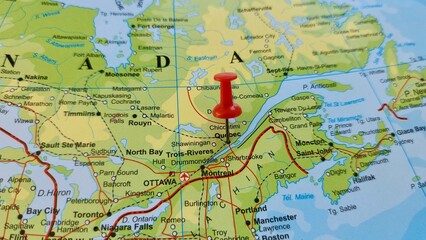 Naklejka premium View of Quebec, is Canada's largest province by area. Located in Central Canada, on a geographical map of America, marked with red push pin