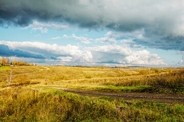 Obraz premium A small village in autumn on the other side of the river