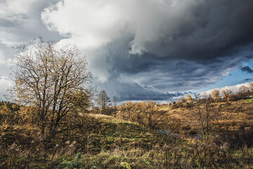 A small village in autumn on the other side of the river