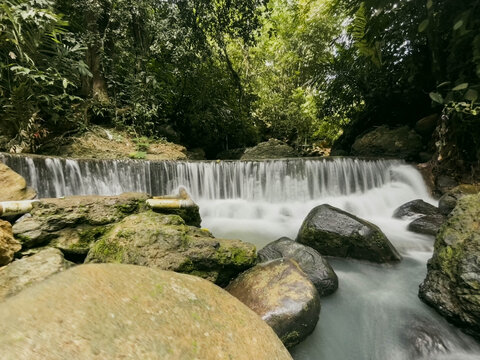 Beautiful Curug Bibijilan waterfall with emerald green water in Sukabumi, West Java, Indonesia.