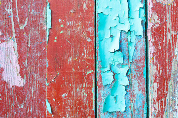 Peeling paint on the old weathered wooden planks, texture background